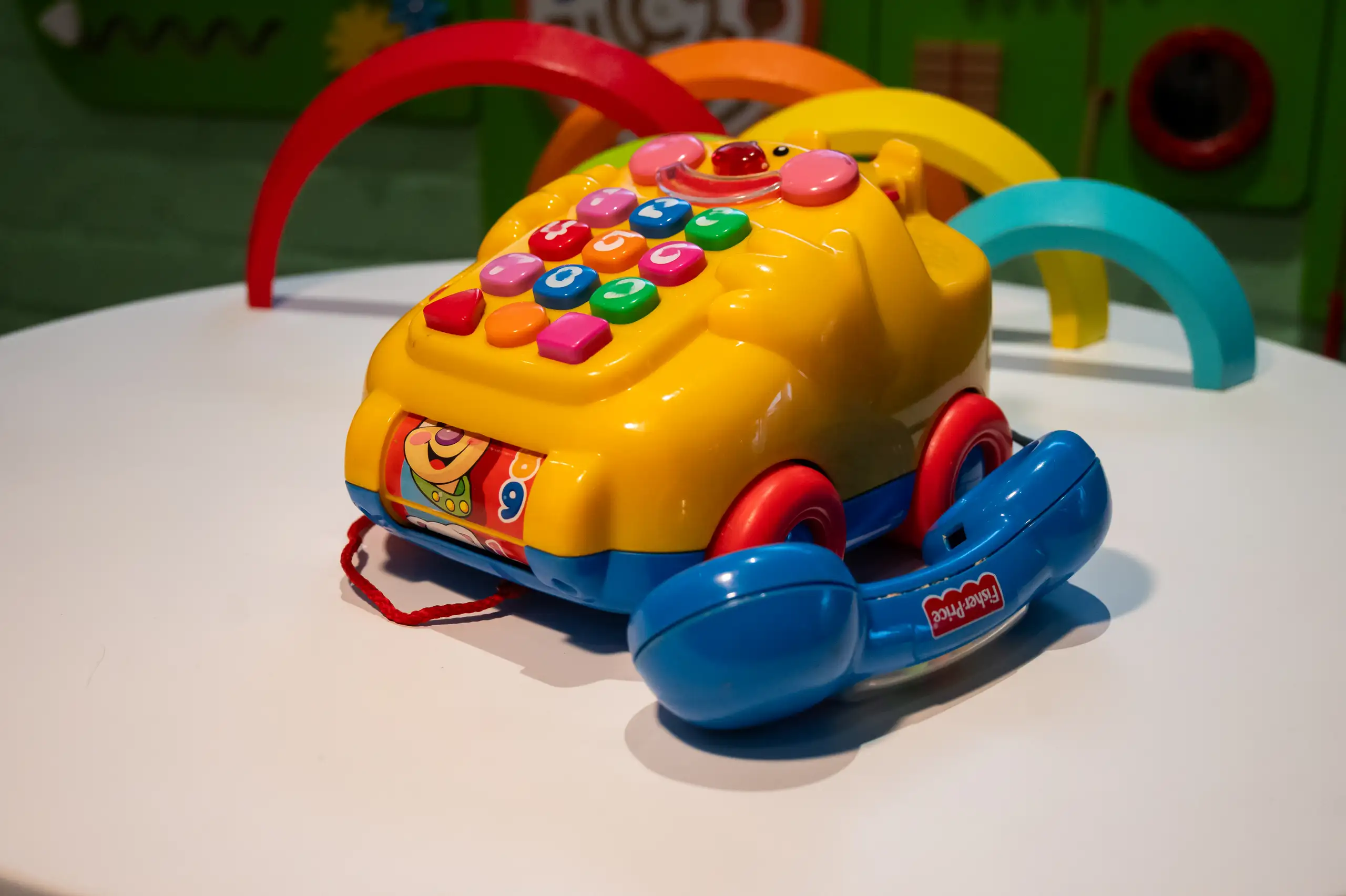 A toy telephone on a table